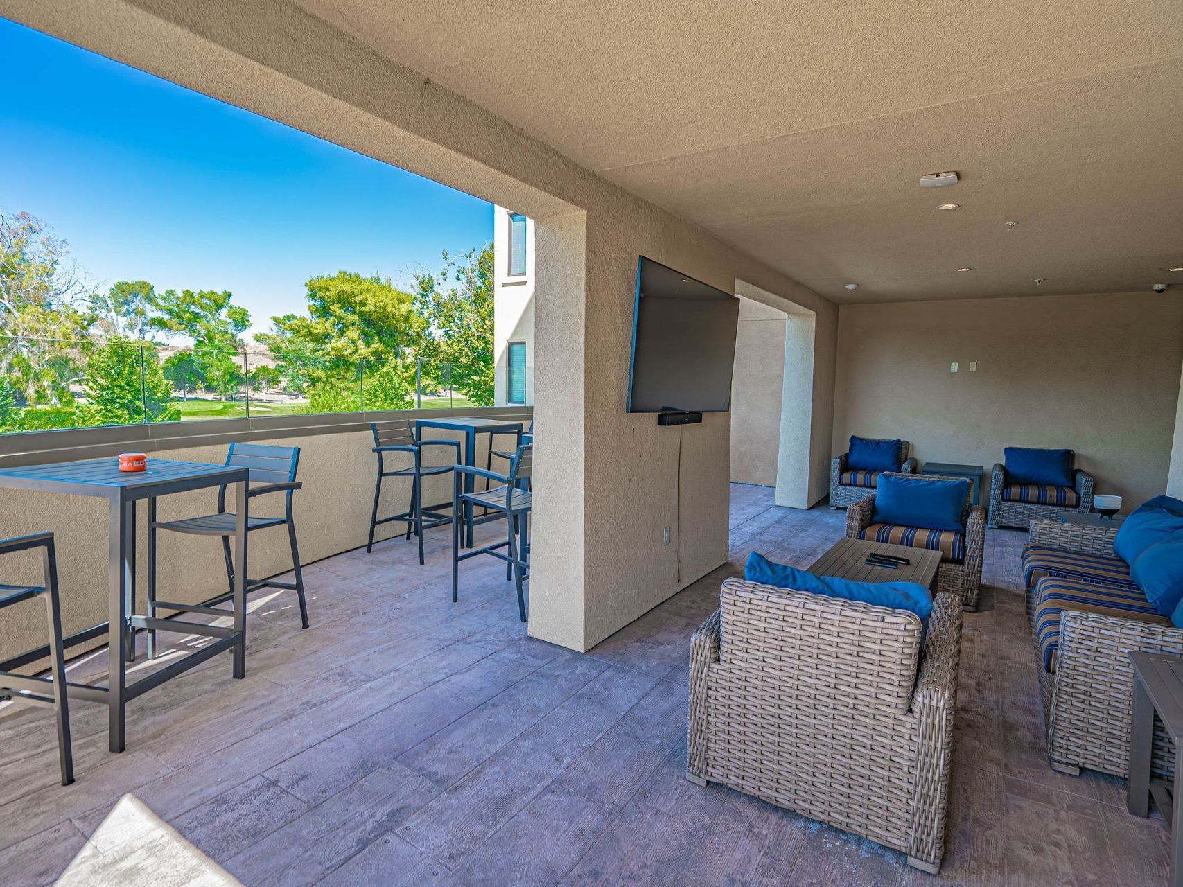 Quill Terrance with TV and seating area and view of the golf course