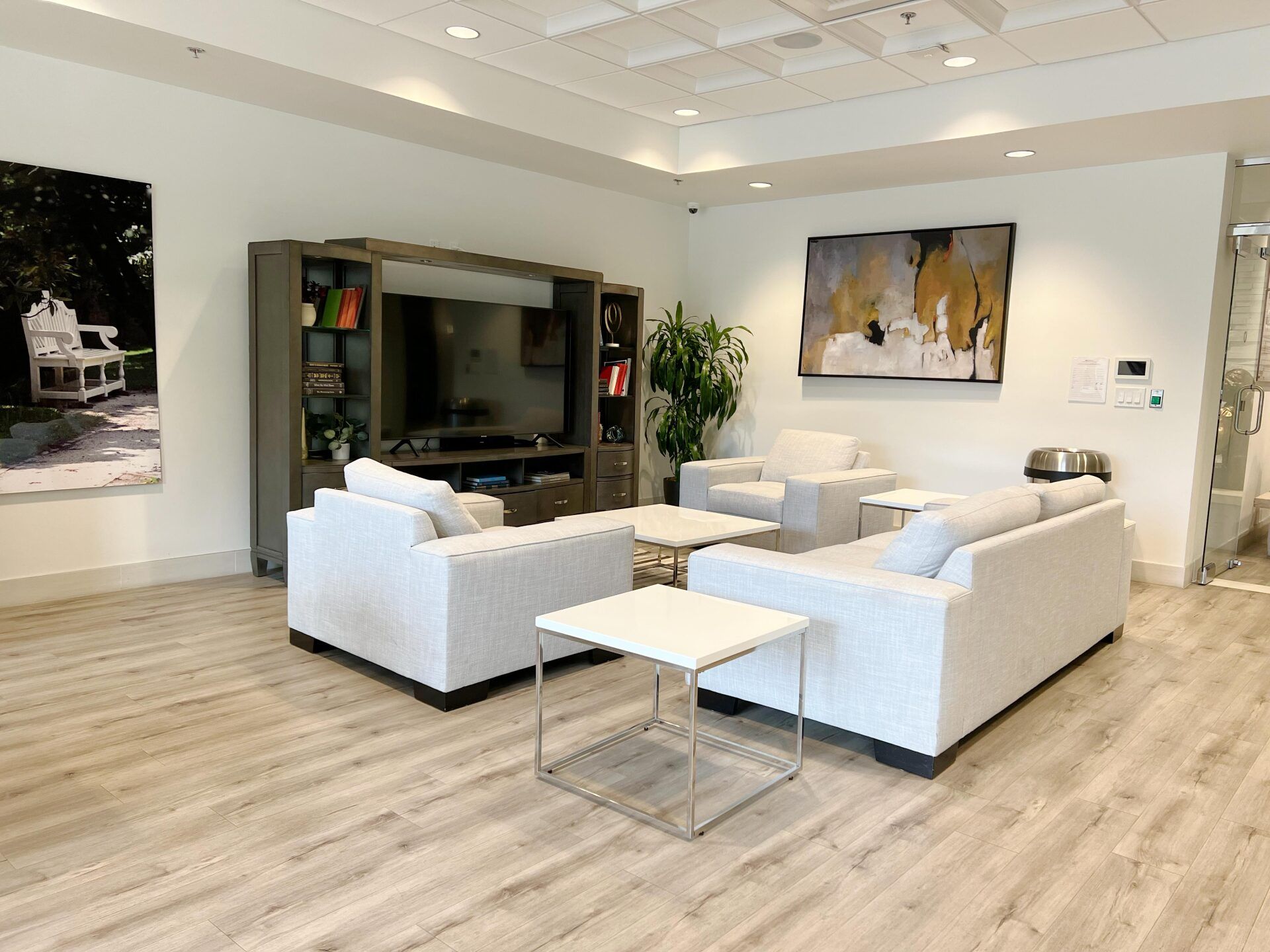 Monticello Apartments lounge area with sofas and tv