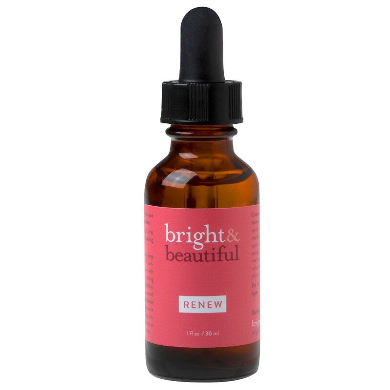A bottle of bright & beautiful renew serum with a dropper