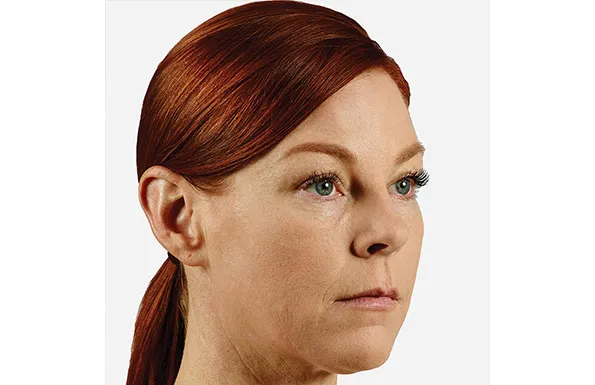 a close up of a woman 's face on a white background