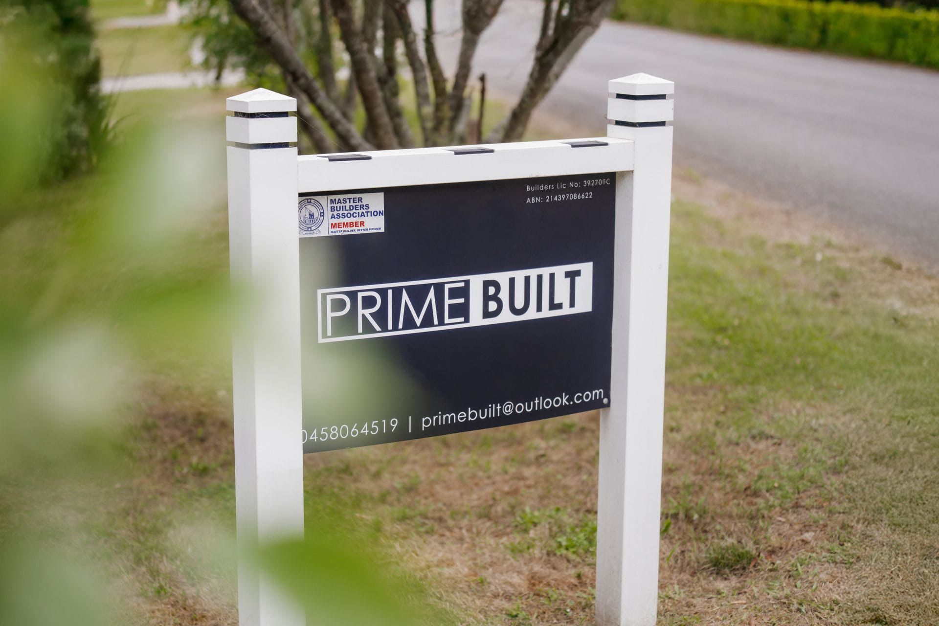 White Yard Sign Reading Prime Built Beside a Road — Prime Built in Bowral, NSW