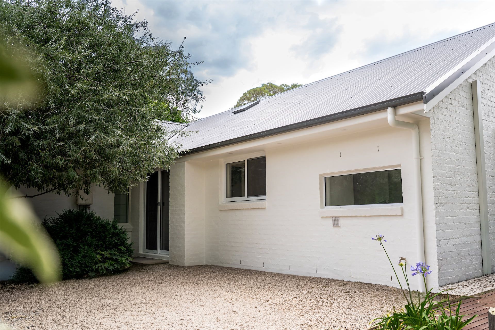 White House Exterior With Gravel Driveway — Prime Built in Bowral, NSW