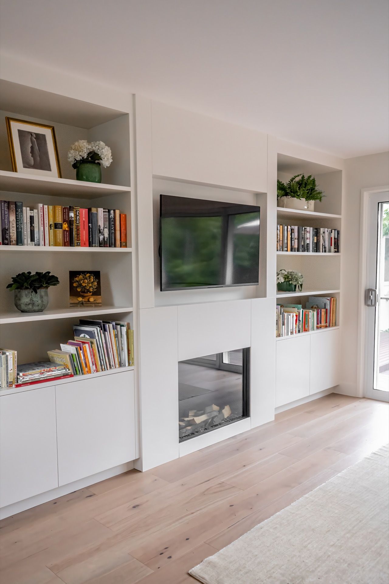 Bright Living Room With Built-in White Shelves, a Wall-mounted TV — Prime Built in Bowral, NSW