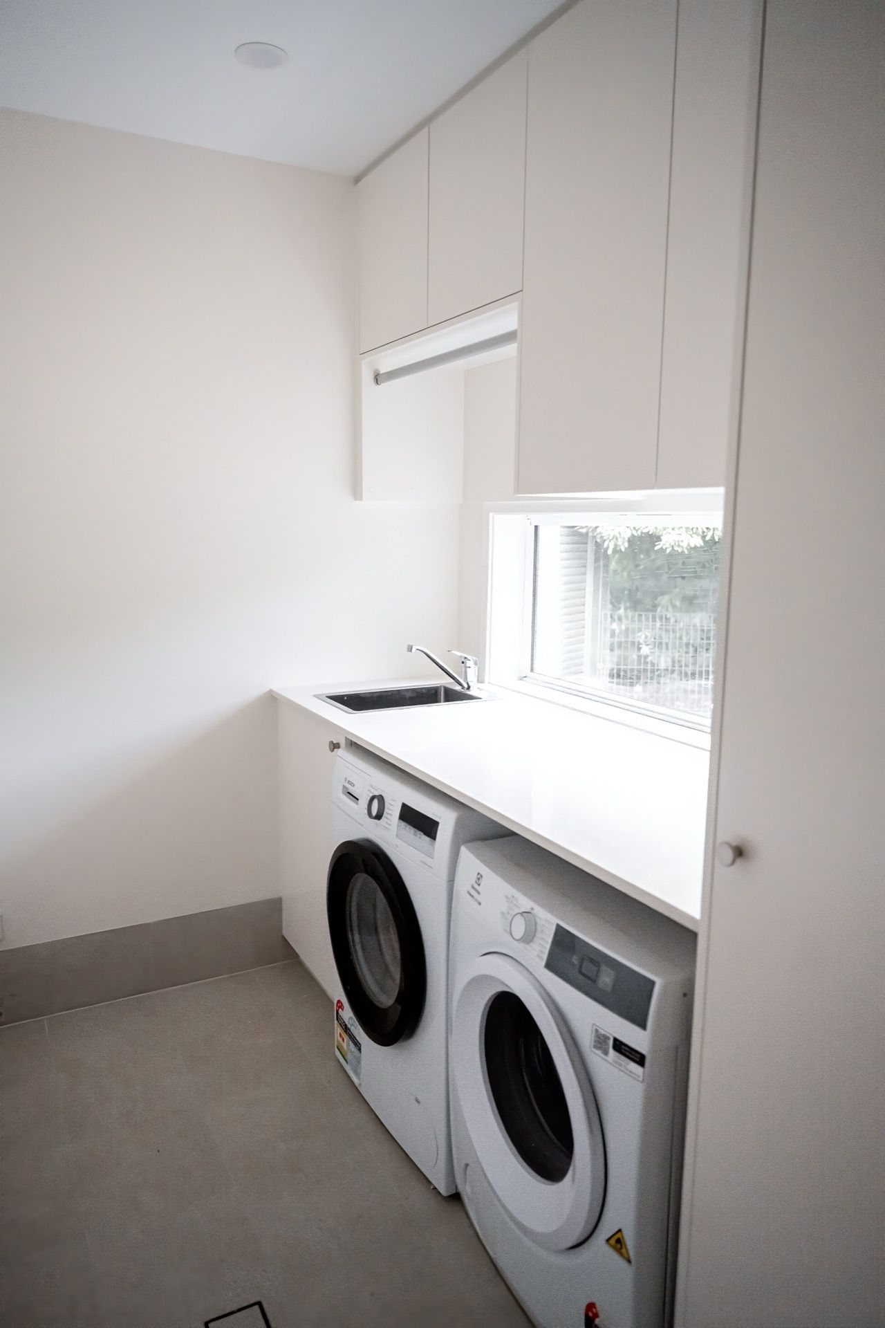 Laundry Room With Stacked Washer and Dryer — Prime Built in Bowral, NSW
