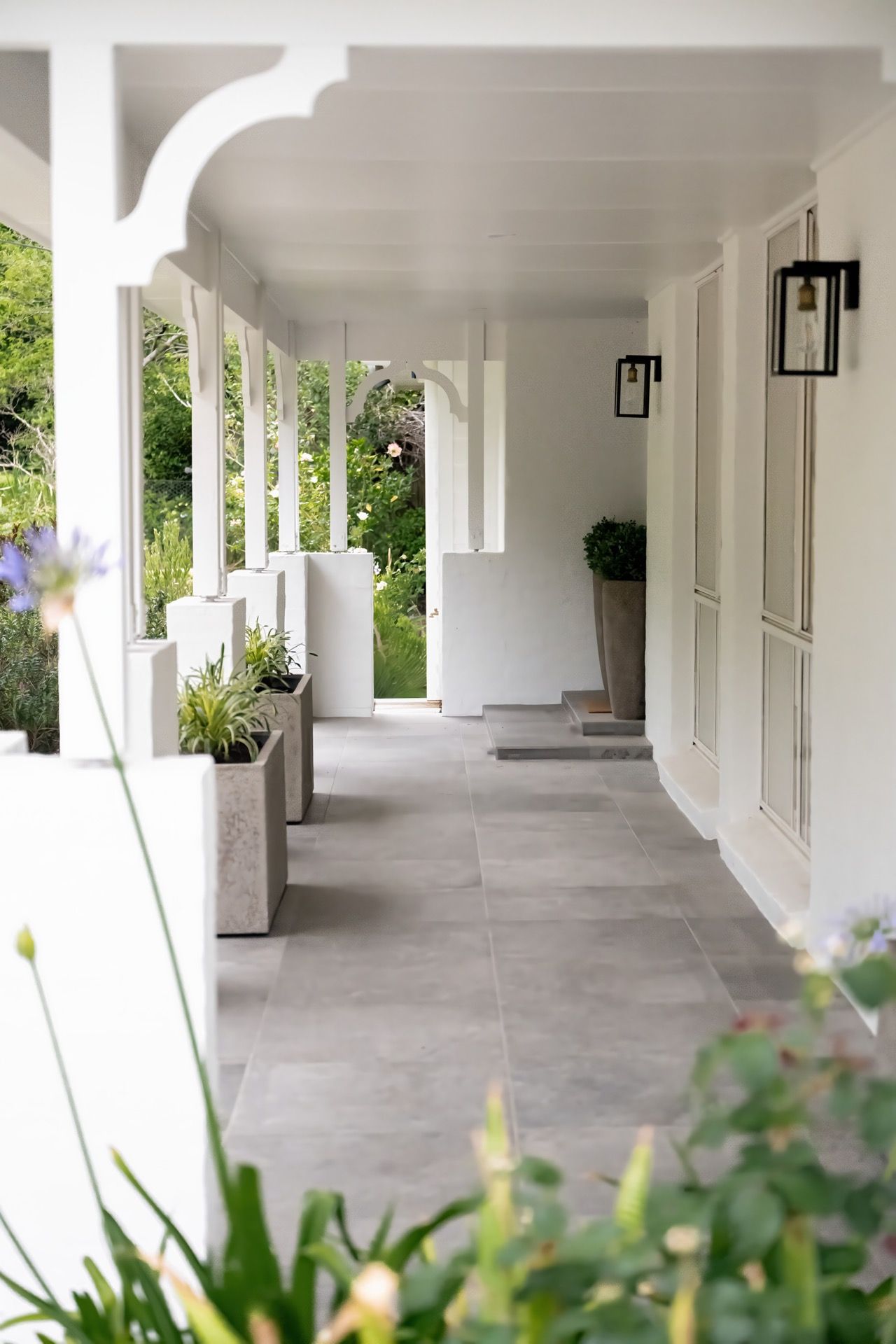 White Porch Corridor With Columns, Hanging Lanterns — Prime Built in Bowral, NSW