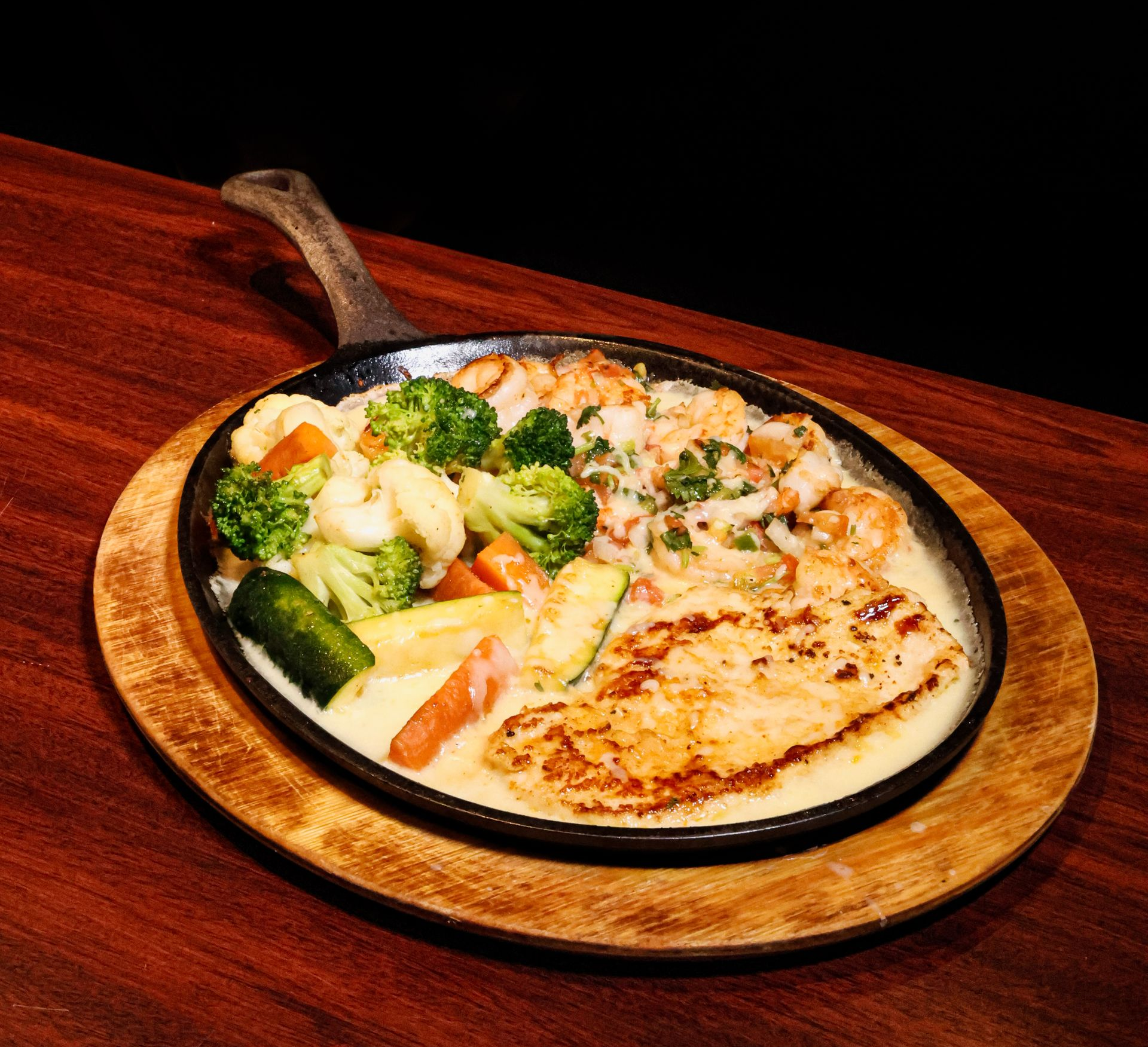 Chicken fajitas with peppers and onions, served in foil at Don Ramon's Mexican Grill.