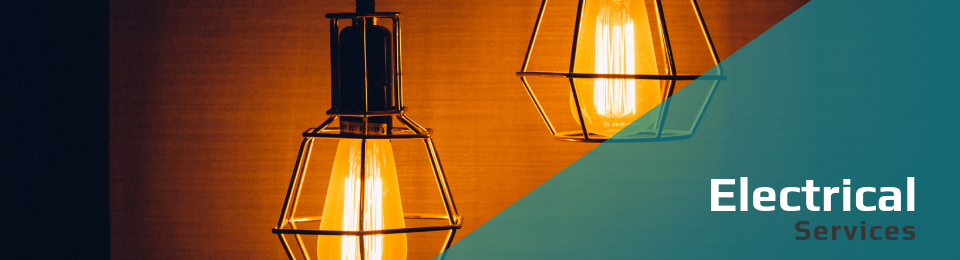 Two pendant light bulbs with wire cages glow warmly against a dark background, labeled