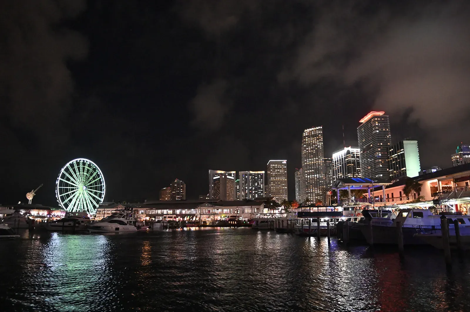 Waterfront marina and nighttime entertainment views during a Bayside Night Cruise in Miami