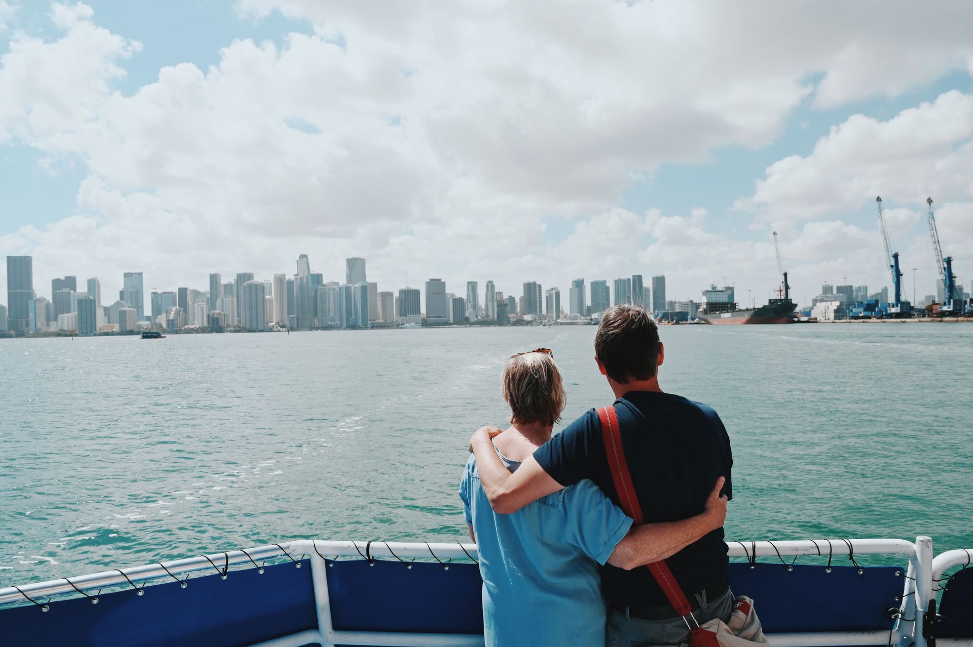 Couple enjoying the Miami skyline from the front of the Best Boat Tour in Miami β moments that inspire Miami Skyline Cruises Reviews.