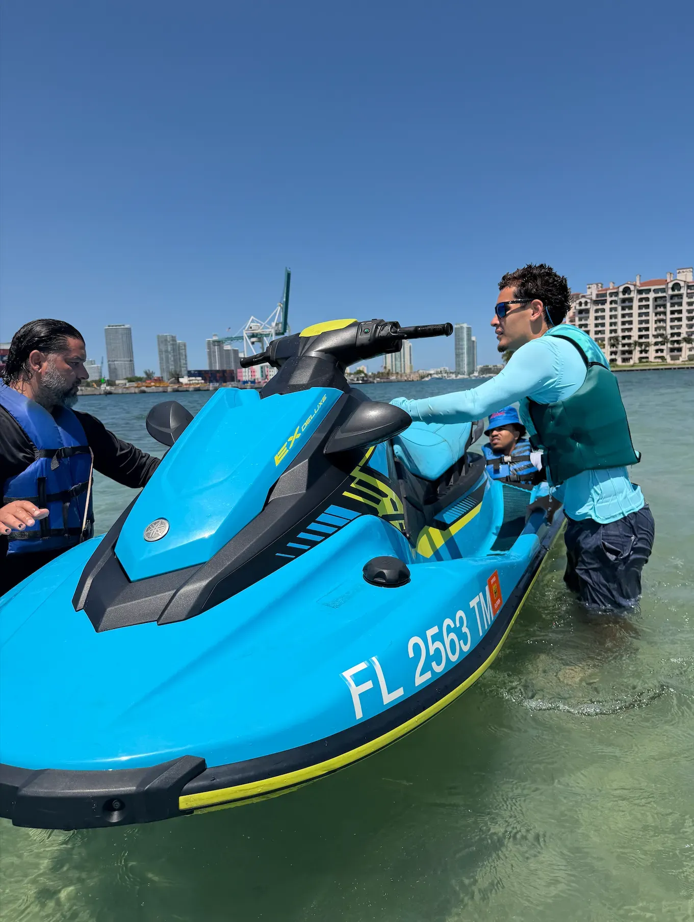 Guests enjoying the Fisher Island only jet ski tour in Miami with a relaxing sandbar stop in Biscayne Bay
