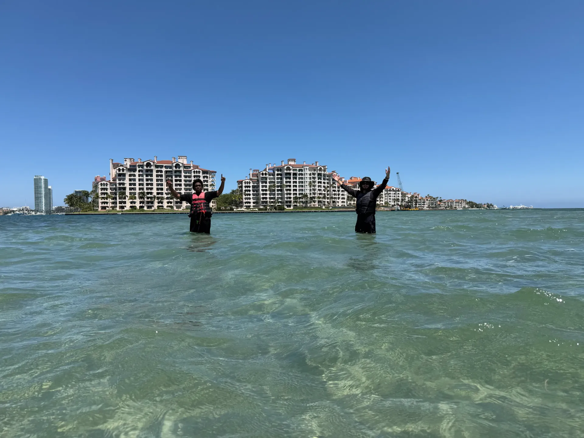 Guests enjoying the Fisher Island sandbar during a guided jet ski tour on Biscayne Bay in Miami