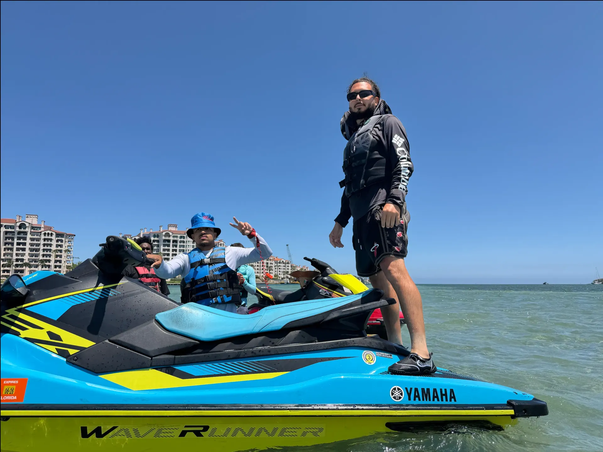 Guests enjoying guided Miami Jet Ski Rentals on a Yamaha WaveRunner in shallow tropical waters