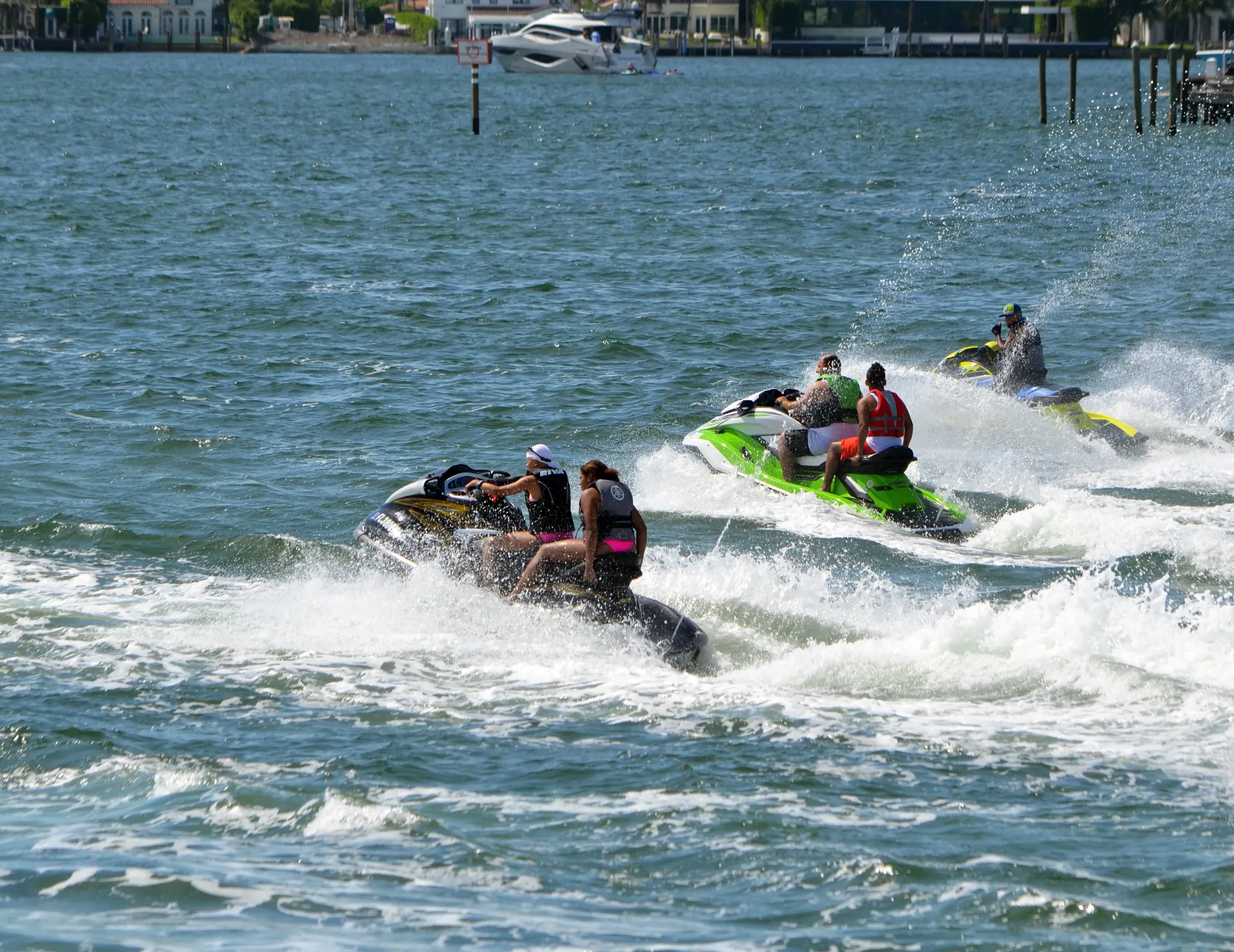Jet Skis riding across Biscayne Bay during a Miami boat cruise