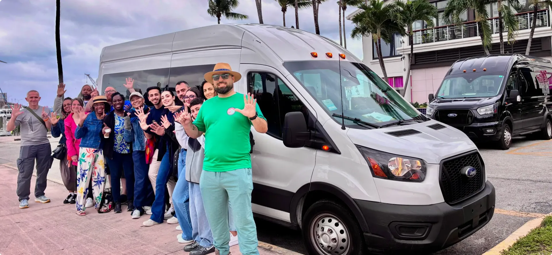 Guests posing in front of a luxury Sprinter van before departing on a Miami 5-in-1 City Tour.