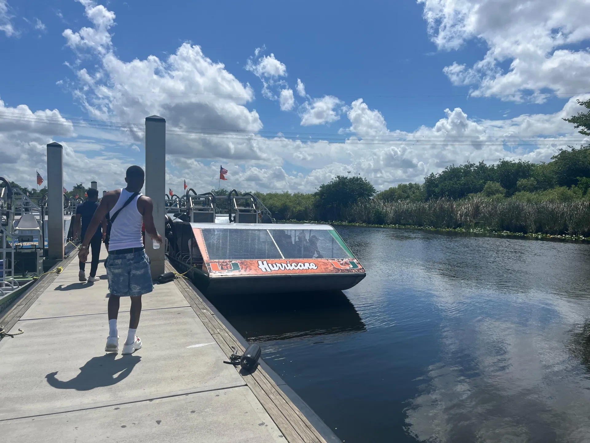 Guests boarding a Miami Everglades airboat before beginning their guided Everglades adventure.