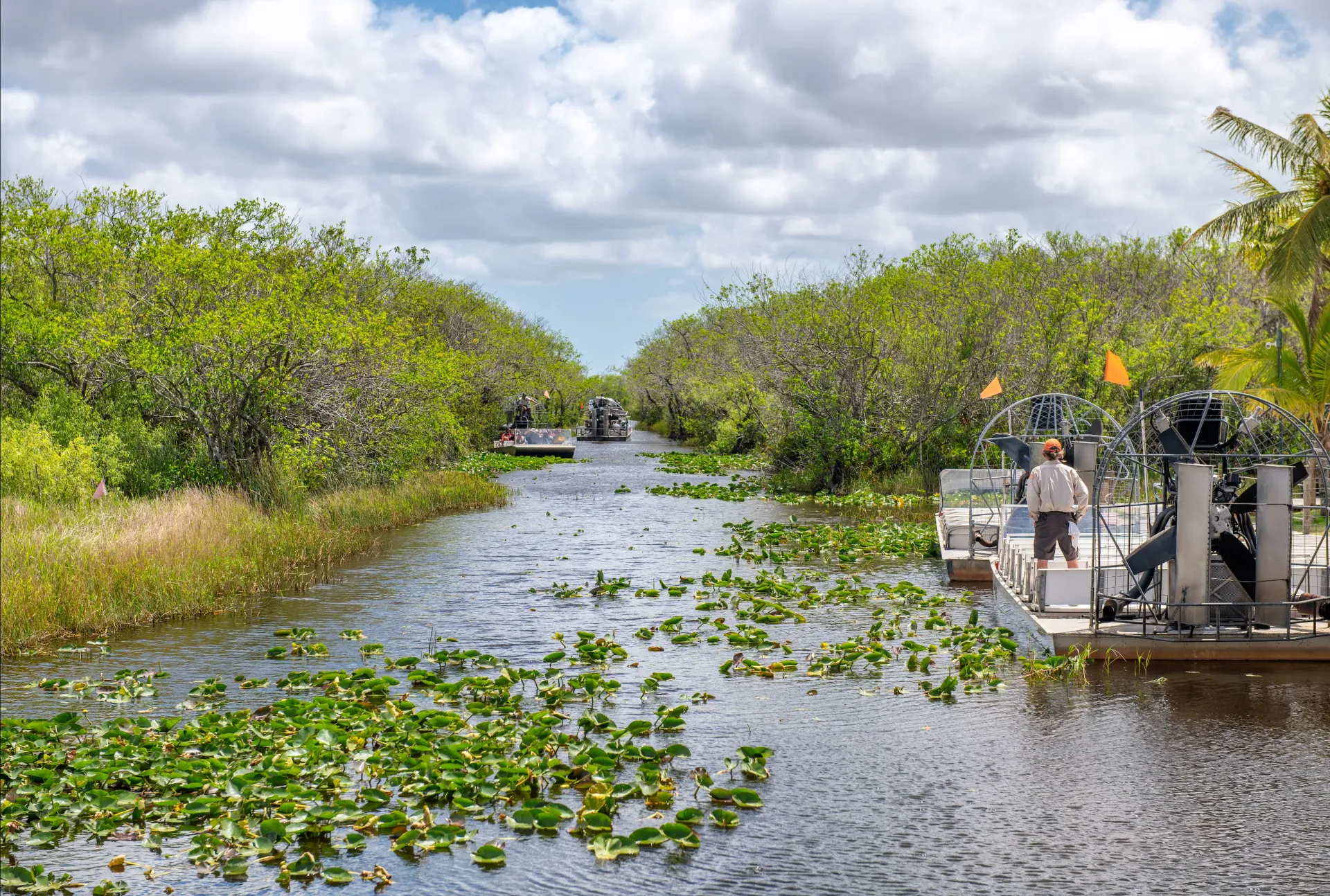 Airboats exploring the Florida Everglades during a guided Miami Everglades airboat tour through native wetlands.