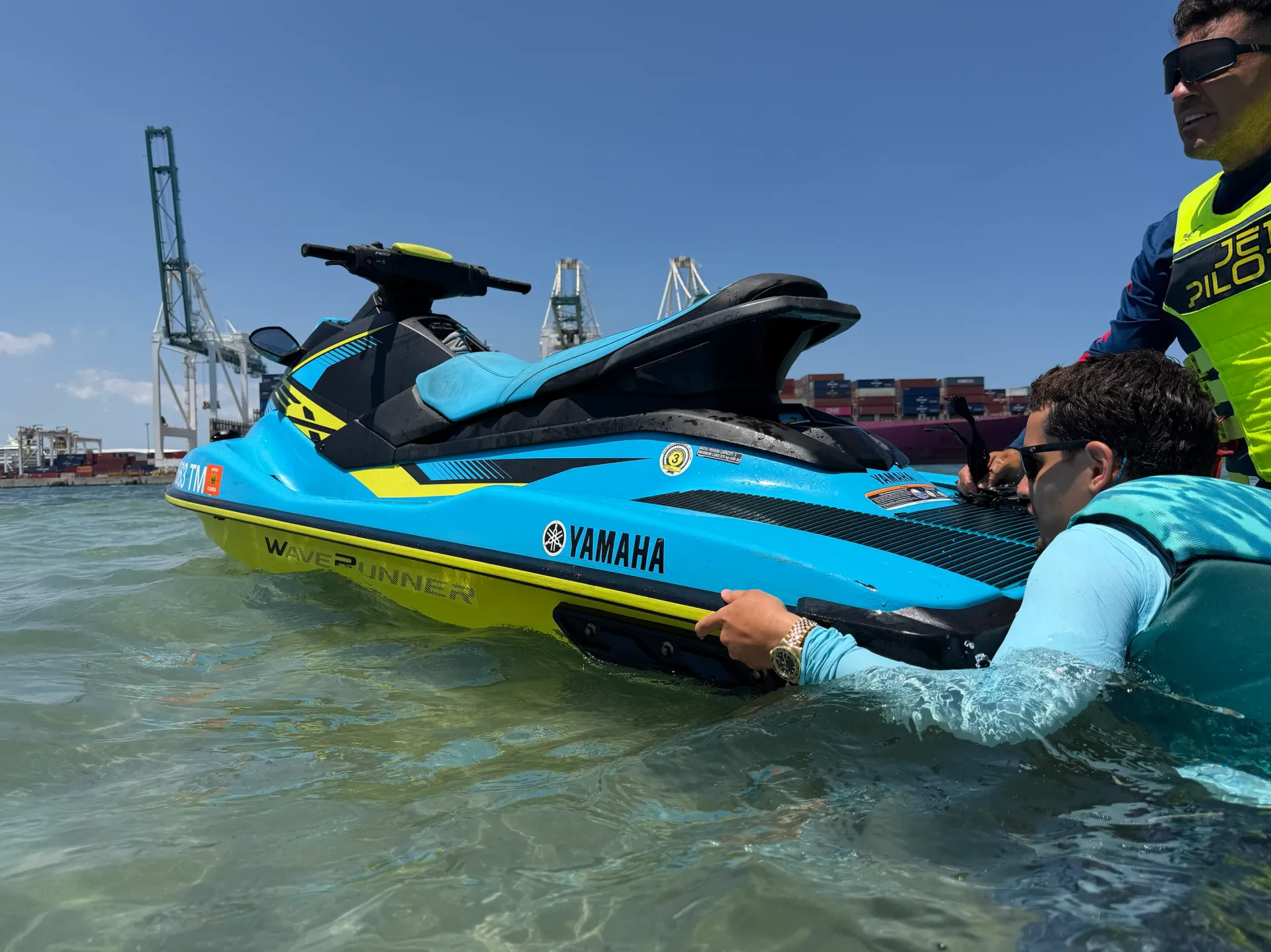 Guide assisting riders during a Miami Jet Ski Rental experience near the Port of Miami on Biscayne Bay