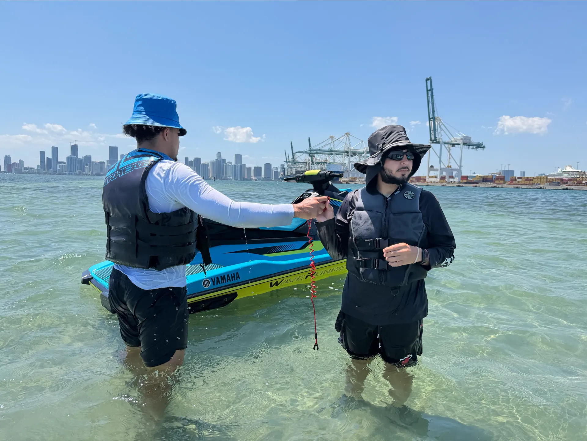 Guests enjoying Miami jet ski rentals during a stop in Biscayne Bay with skyline views