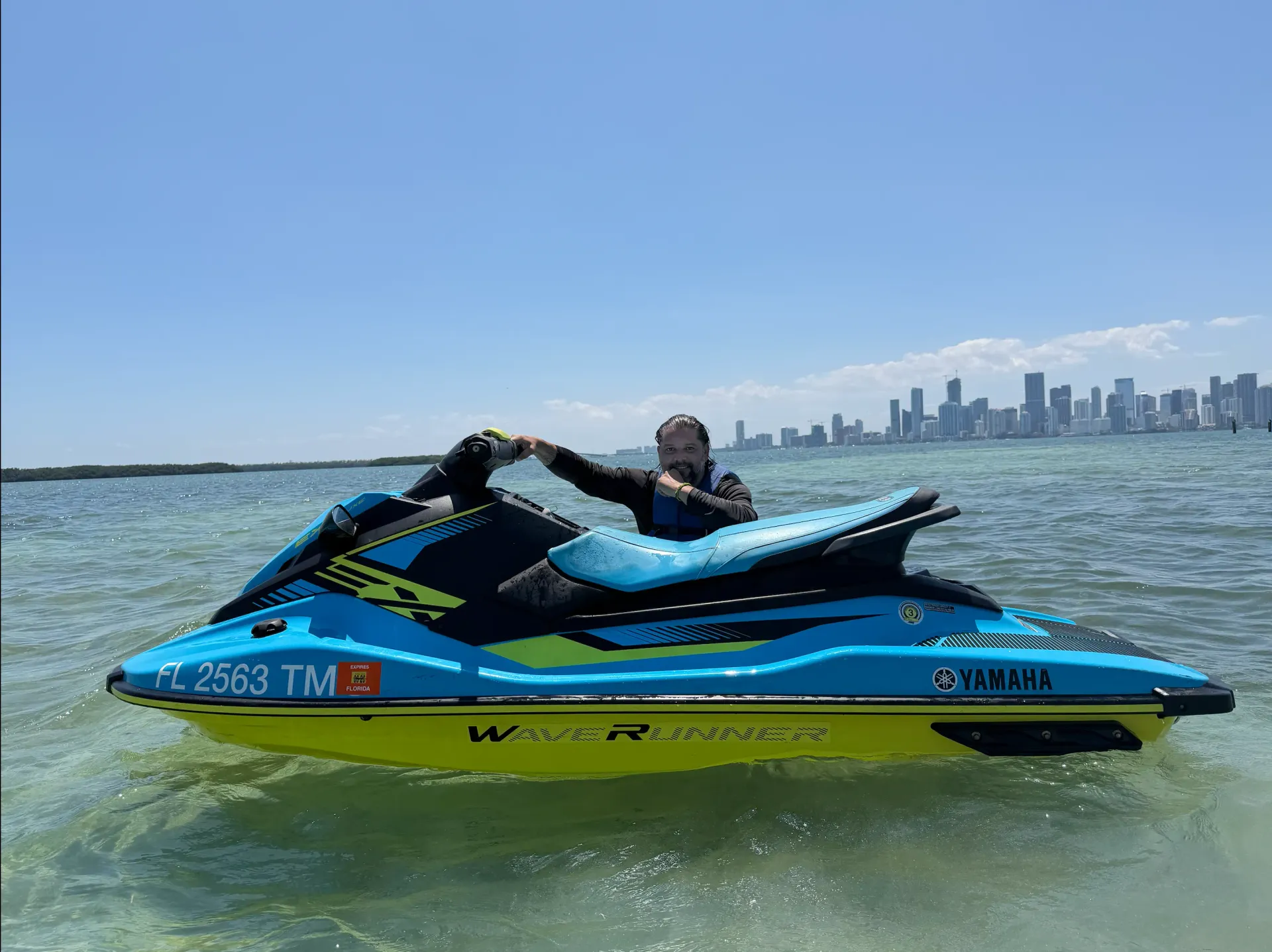 Miami Jet Ski Rentals from Bayside riding through Biscayne Bay with the Downtown Miami skyline in the background