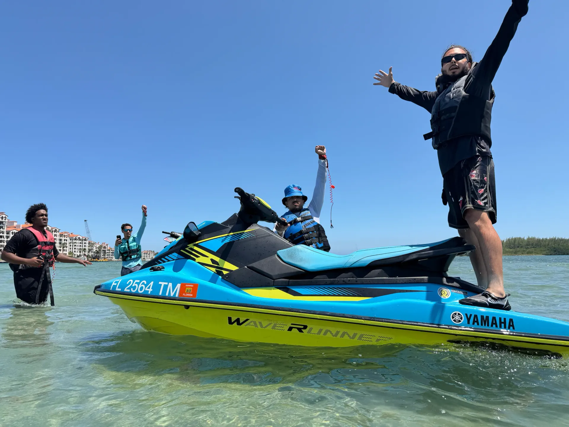 Guests enjoying a Yamaha WaveRunner during Miami Jet Ski Rentals in shallow tropical waters near Downtown Miami