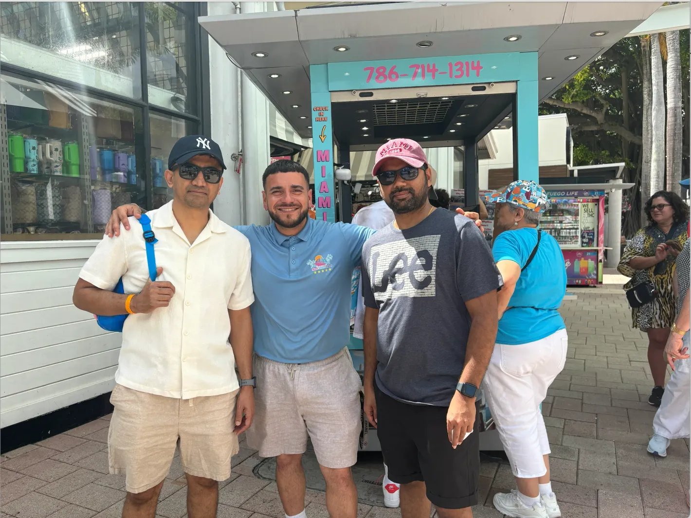 Customer service team assisting guests before a Miami sightseeing cruise at Bayside Marketplace.