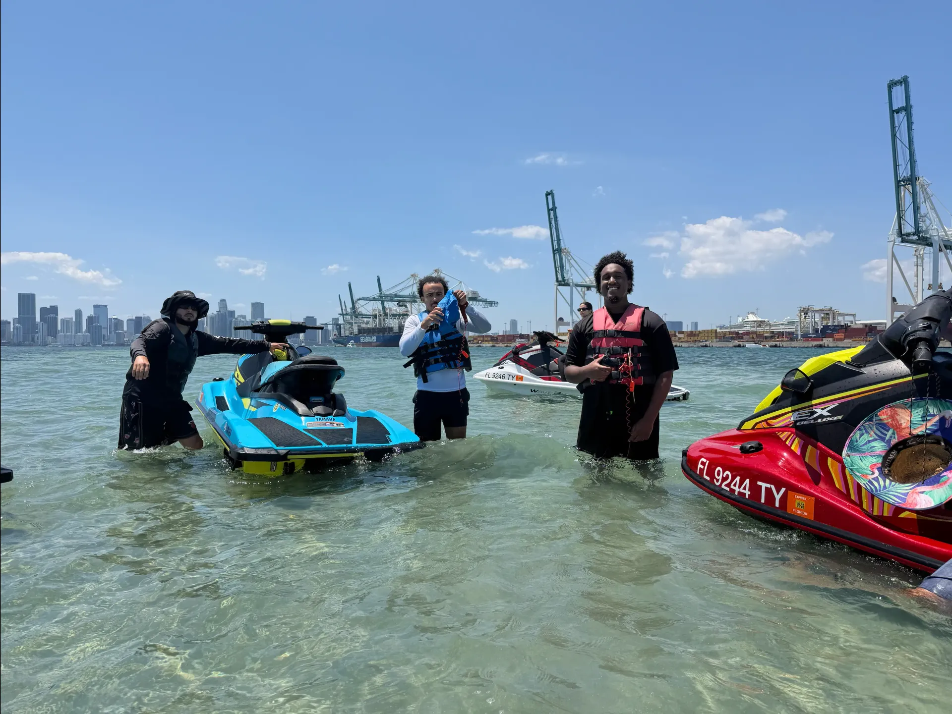 Guests enjoying Miami Skyline Jet Ski Rentals during a guided group tour near the Downtown Miami waterfront
