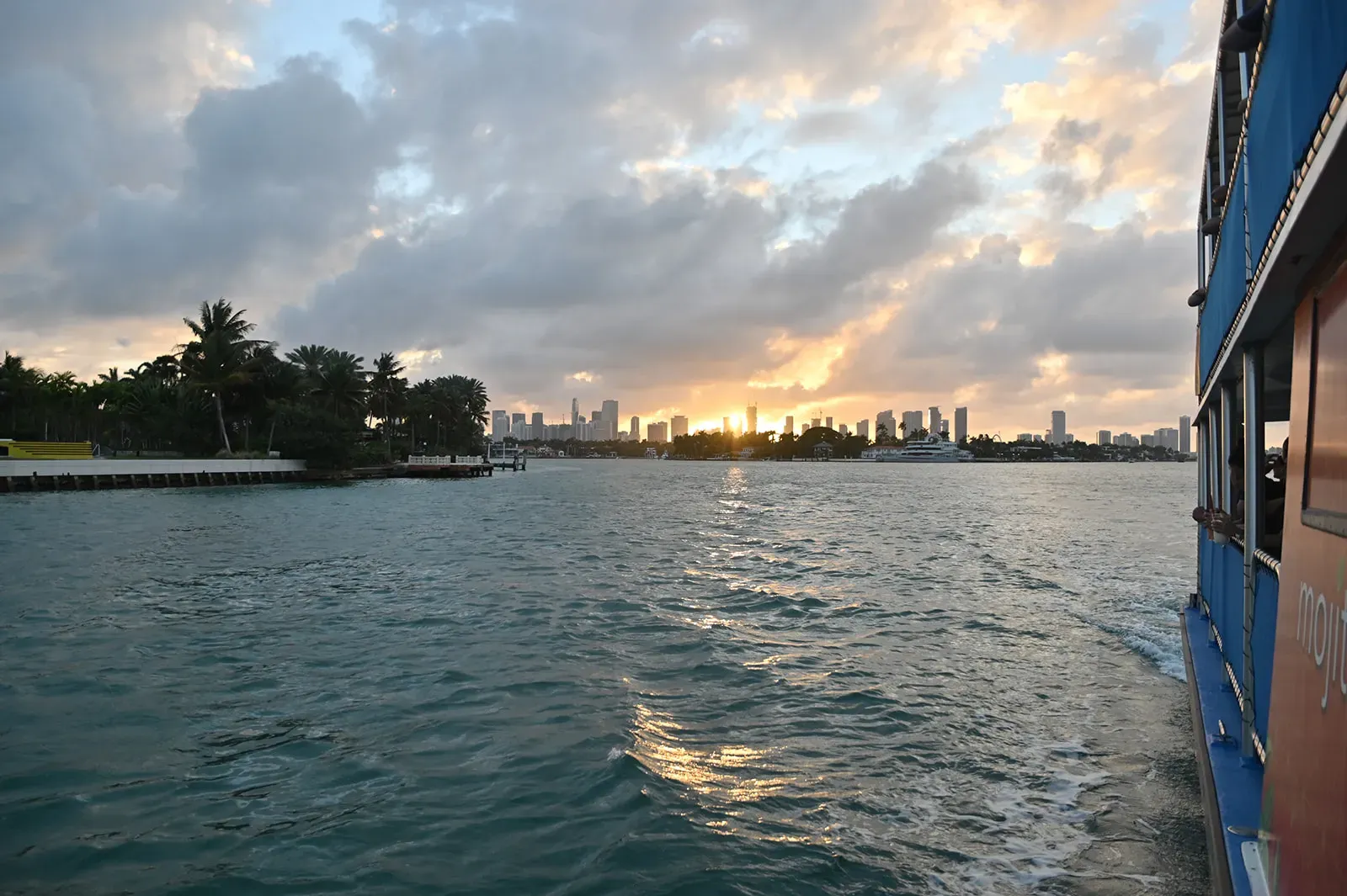 Golden hour skyline views during a sunset tour in Miami from the water near Downtown Miami