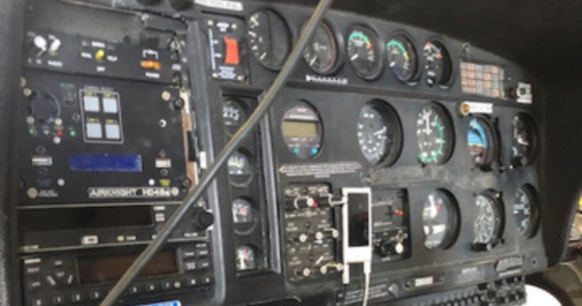 Aircraft instrument panel with legacy avionics and analog gauges before an avionics upgrade in Bould