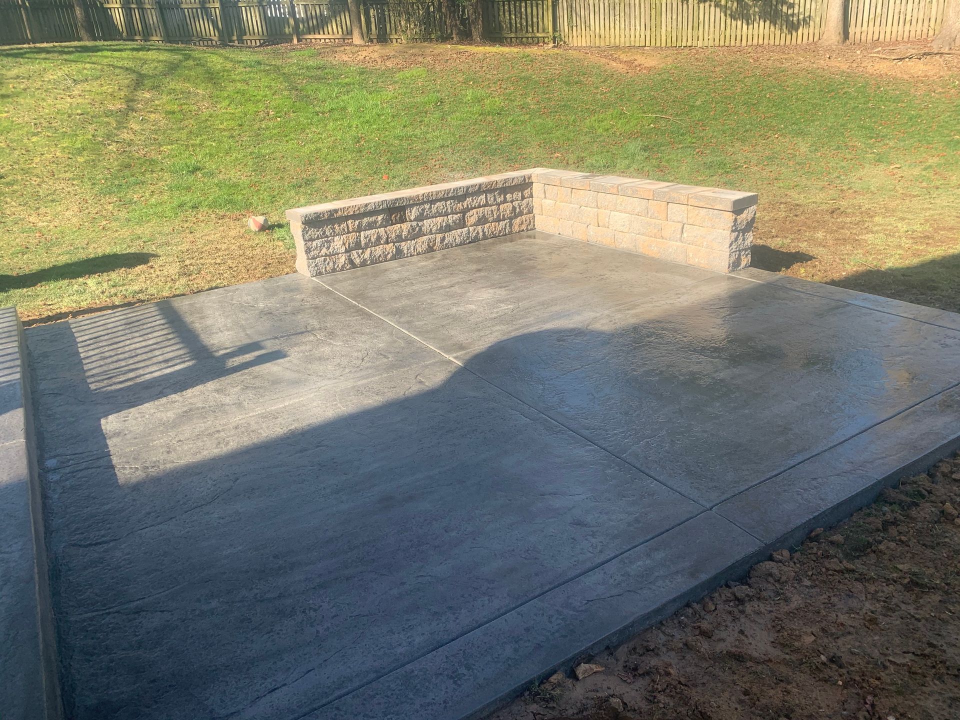 Decorative Stamped Concrete Patio and Sitting Wall installed on Lewis Lane in Havre de Grace, MD by Crockett & Sons Concrete