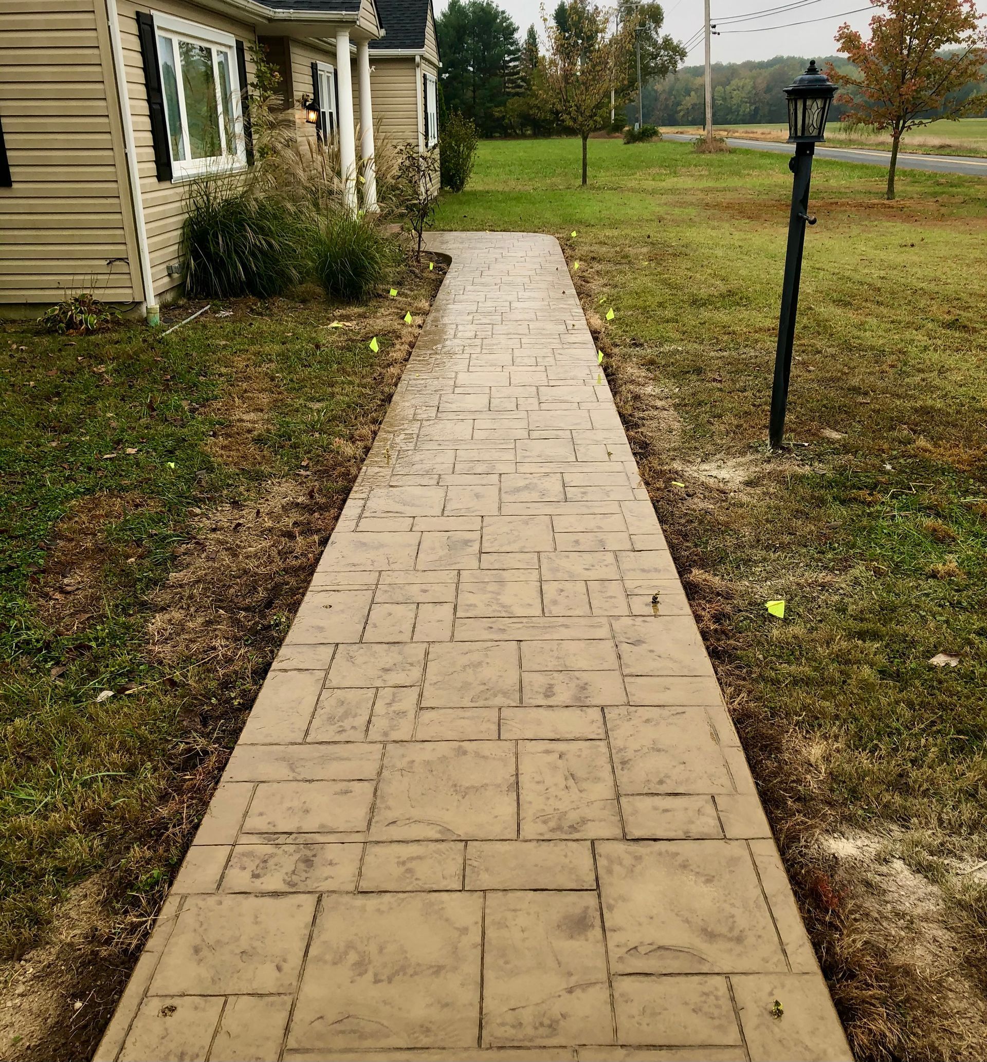 Decorative Stamped Concrete Sidewalk installed by Crockett & Sons Concrete on Aldino Road in Aberdeen, Maryland