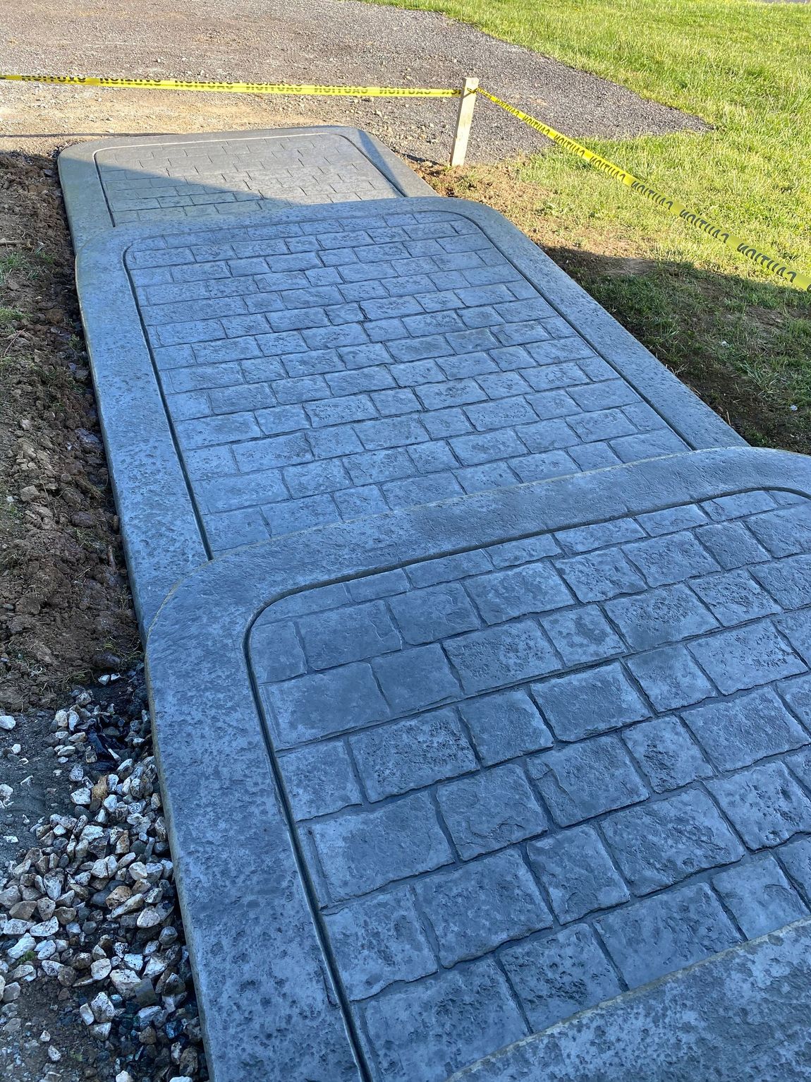 Cobblestone stamped concrete sidewalk installed in Conowingo, MD