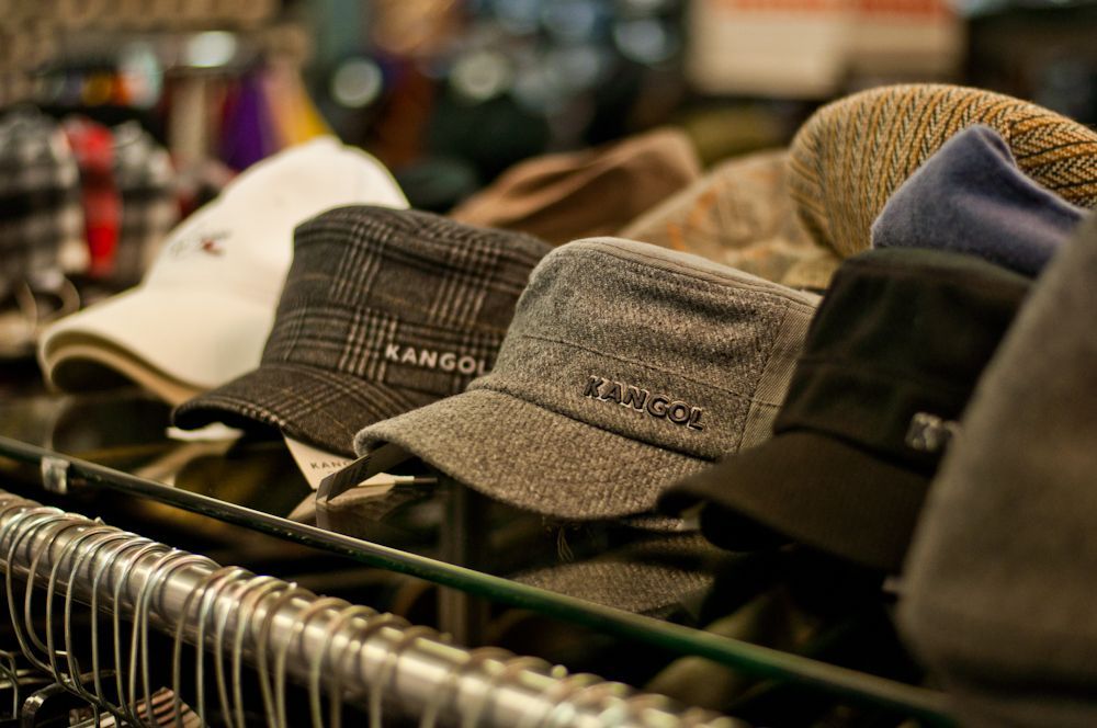 Assorted men's casual caps displayed at Blakley Mitchell