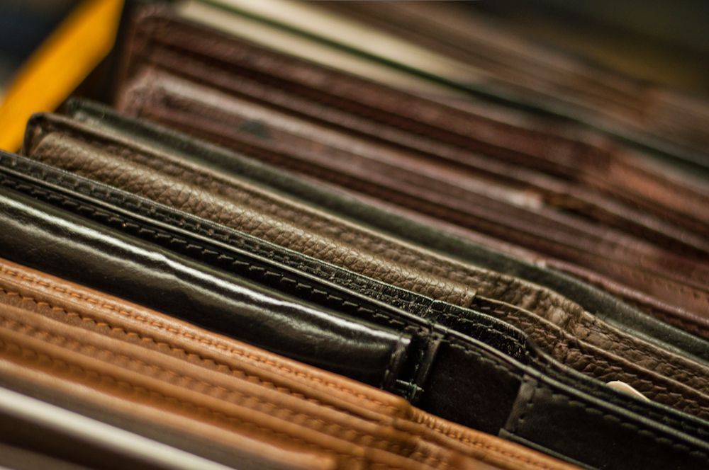 Close-up of men's leather accessories at Blakley Mitchell