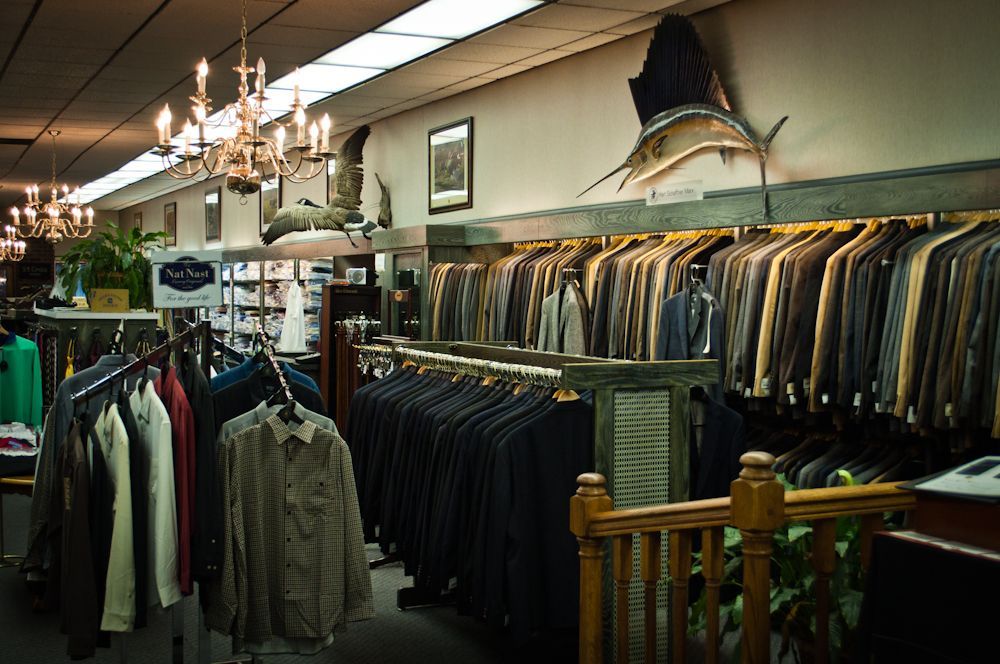 Men's clothing racks and displays inside Blakley Mitchell