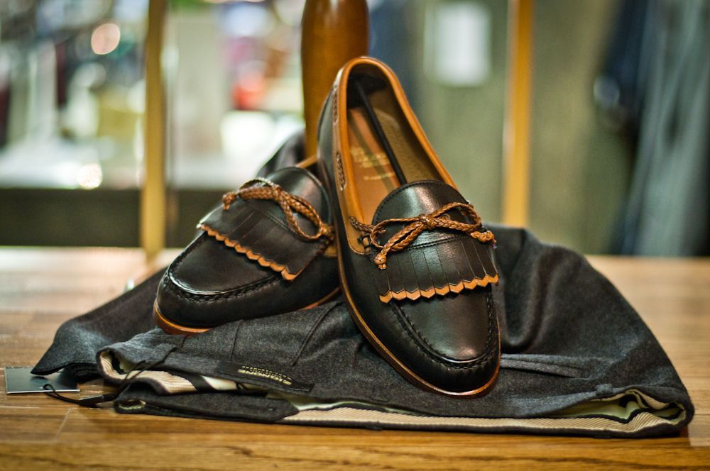 Men's leather loafers displayed with coordinating apparel