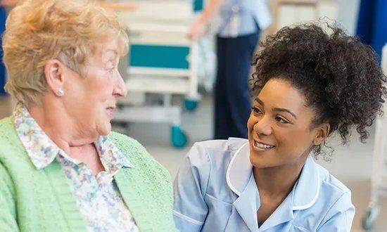Medical staff talking to patient