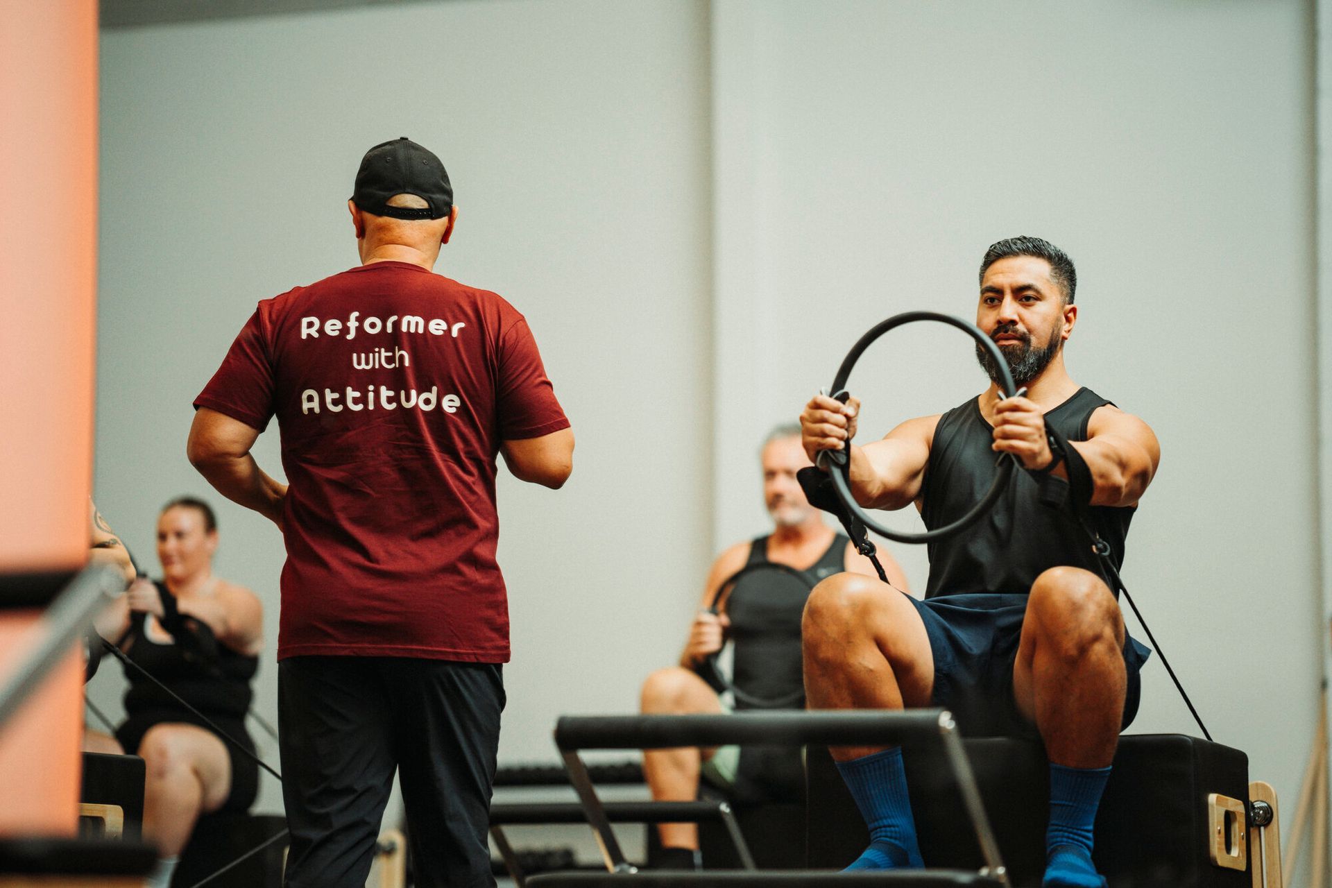 Rebel Bros leading a Bro-Lates reformer pilates class at Rebel Pilates