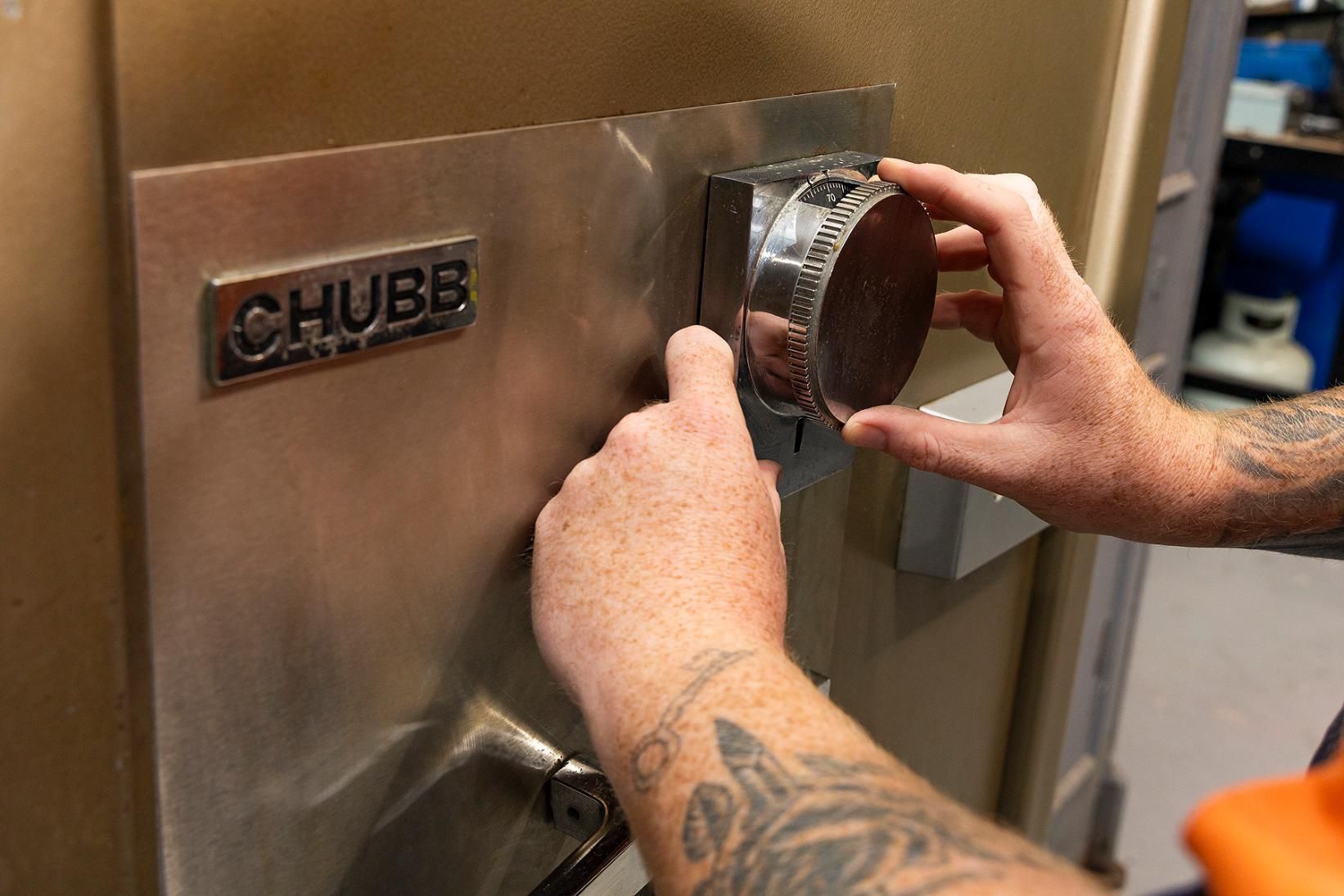 Person's Hands Turning the Dial on a Chubb Safe — Active 247 Locksmith and Security Services Forster In Forster, NSW