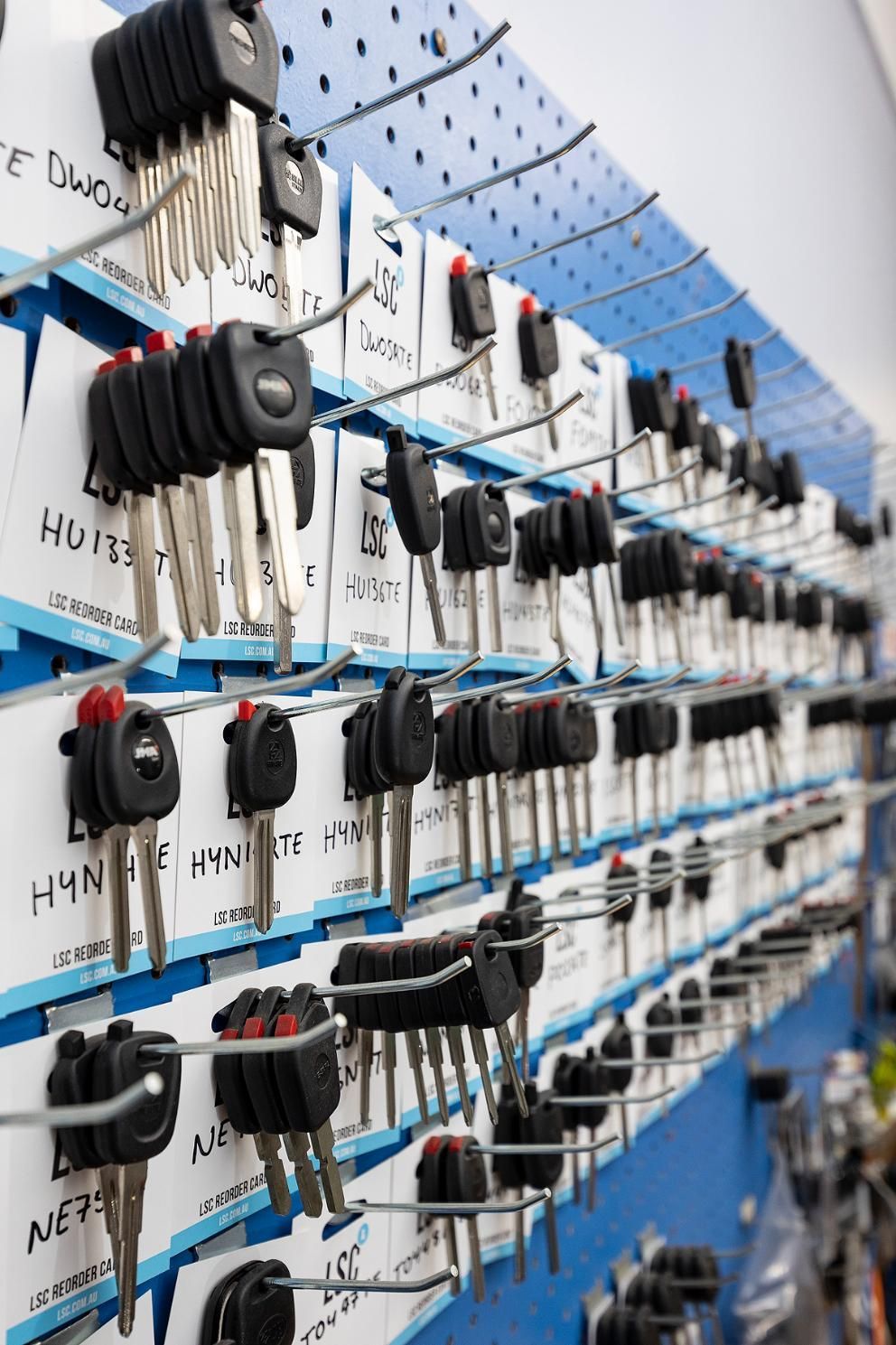 A Display of Car Keys on a Pegboard, Organized — Active 247 Locksmith and Security Services Forster In Forster, NSW