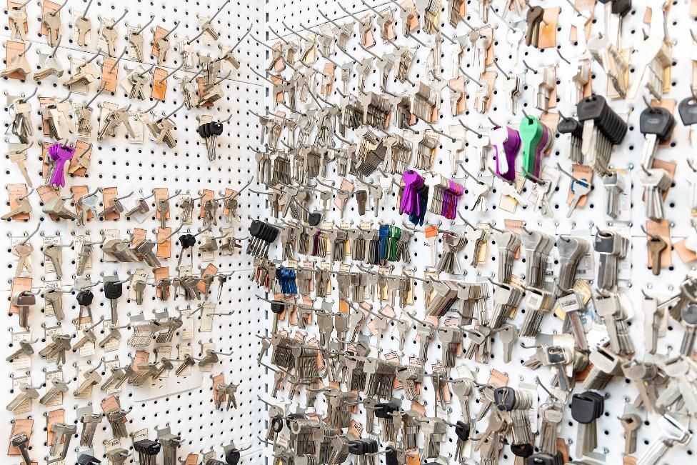 Keys Hanging on a White Pegboard, in a Locksmith Shop — Active 247 Locksmith and Security Services Forster In Forster, NSW