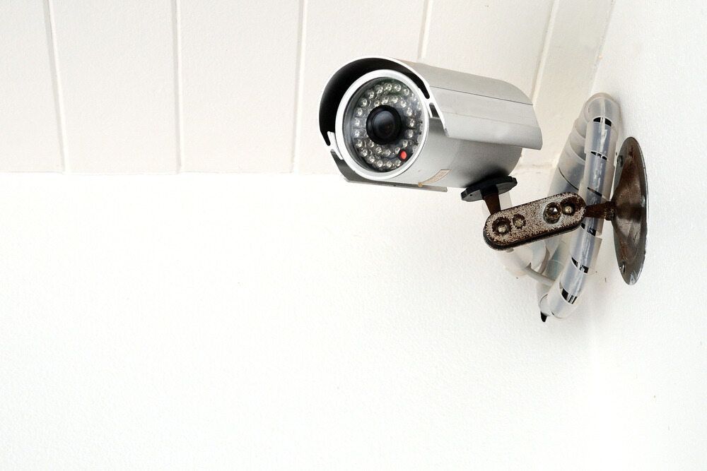A Security Camera Is Mounted on A White Wall — Active 247 Locksmith and Security Services Forster In Tuncurry, NSW