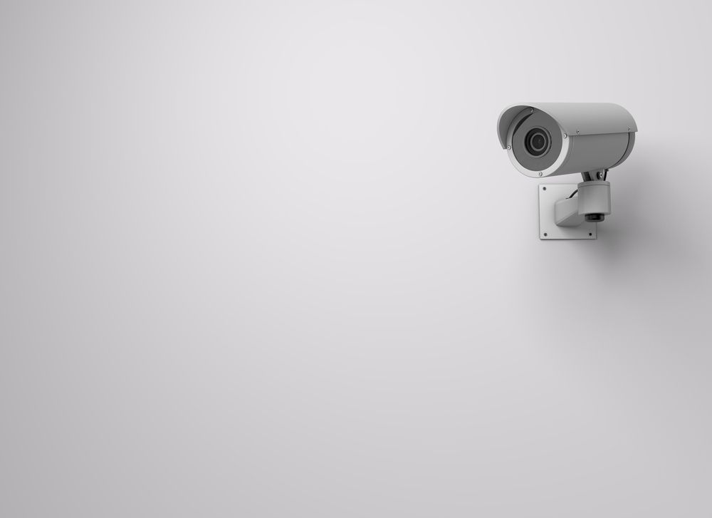 A Security Camera Is Mounted to A White Wall — Active 247 Locksmith and Security Services Forster In Wingham, NSW