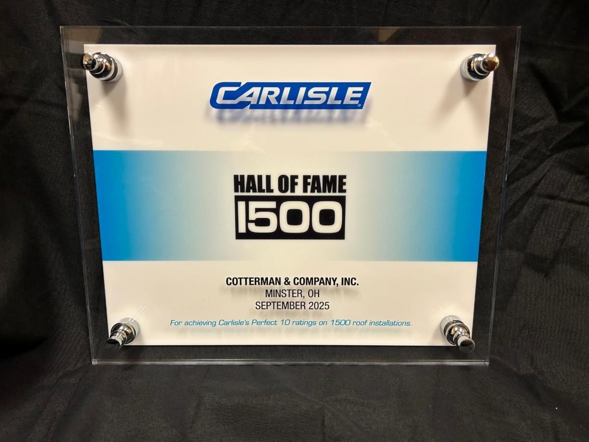Carlisle Hall of Fame 1500 plaque in a clear frame with four corner mounts on a dark background