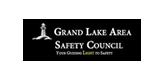 Grand Lake Area Safety Council logo with a lighthouse and text on a black rectangle.