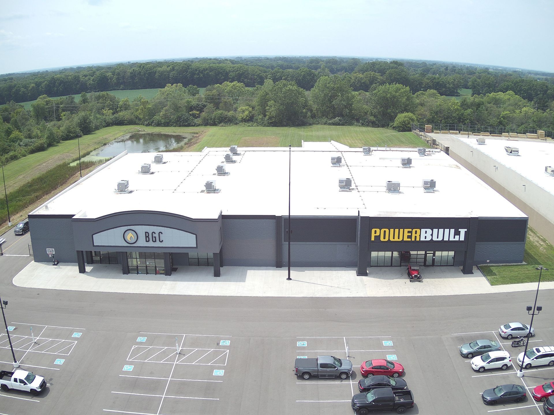 Aerial view of two adjacent warehouses, one labeled 
