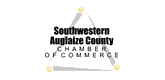 Logo for Southwestern Auglaize County Chamber of Commerce. Black text in a triangle with yellow dots.
