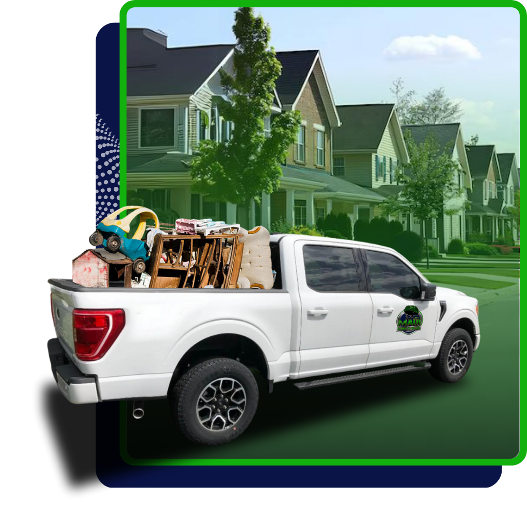 A white pickup truck filled with assorted junk with houses on the background.