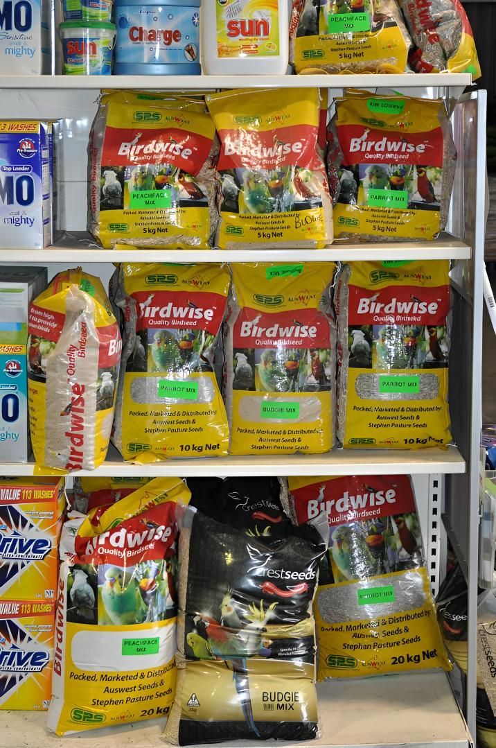 A Shelf Filled With Bags of Bird Food in a Store — MacCallum & Company In Scone, NSW