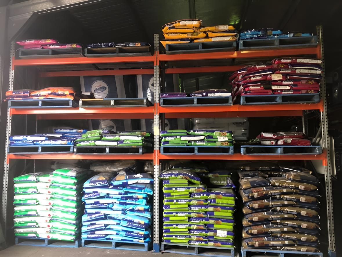 A Warehouse Filled With Lots of Bags of Dog Food — MacCallum & Company In Scone, NSW