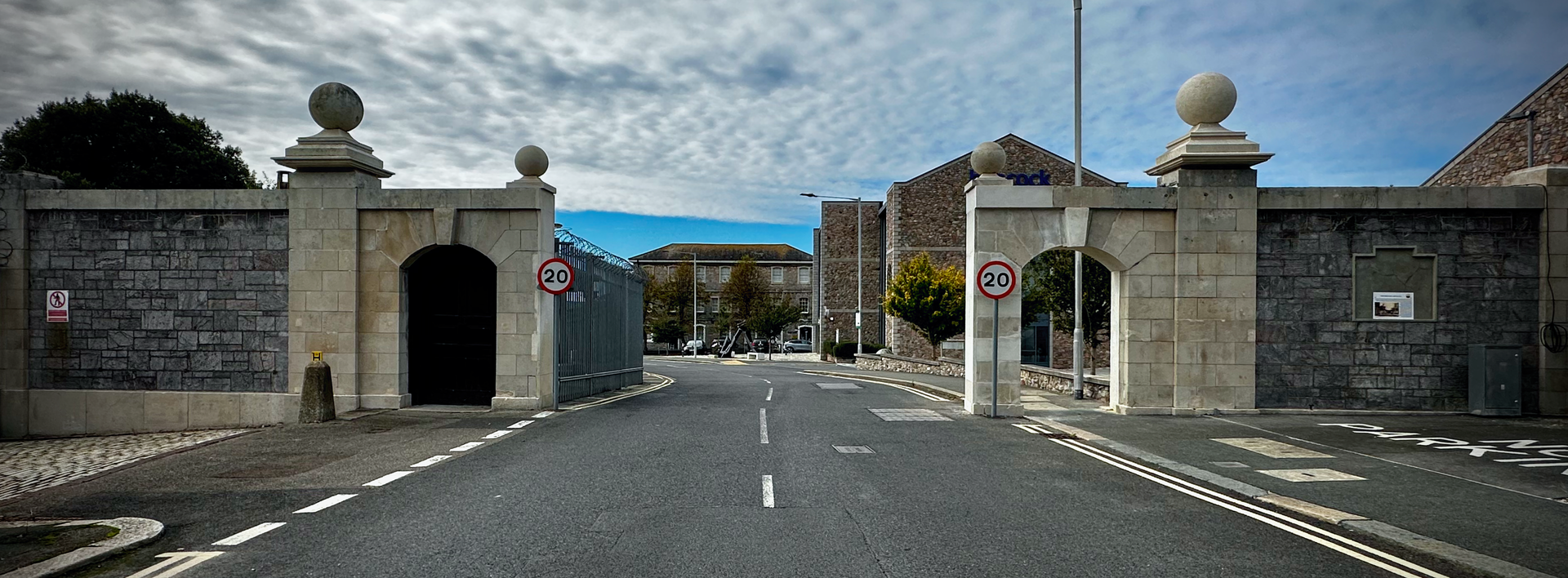 Reconstructed historic dockyard wall and stone arch at Oceansgate, Plymouth, following conservation.